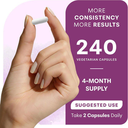 Hand holding a magnesium capsule beside the bottle