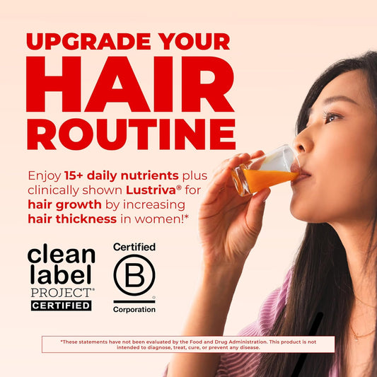 Woman drinking the liquid multivitamin with a glass